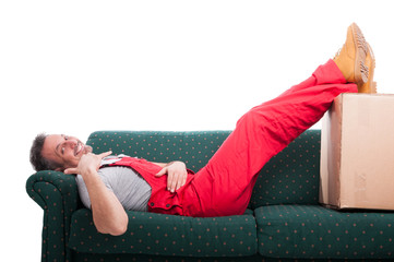 Mover man laid on couch making calling gesture