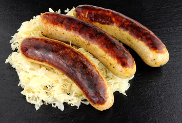 Fried Bratwurst Sausages And Sauerkraut