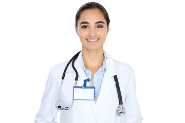 Fototapeta premium Cheerful smiling female doctor isolated over white background. Latin american or Hispanic young woman