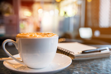 Cup of cappuccino in coffee ship 