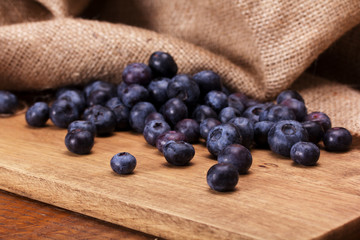 Split blueberries on a rustic wooden background