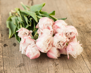Romantic flower bouquet on vintage wooden background