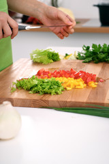 Close up of  woman's hands cooking in the kitchen. Housewife slicing ​​white bread. Vegetarian and healthily cooking concept