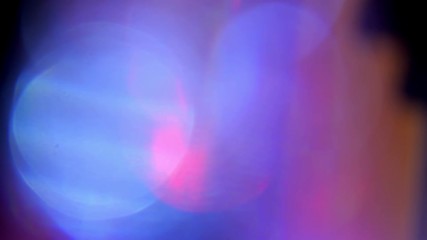 Light leak background. Light pulses and glows. Lots of different colors and tones. In the style of light leaks - real effect.