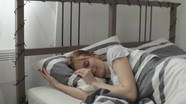The Dog Awakens The Sleeping Beautiful Girl on the Bed