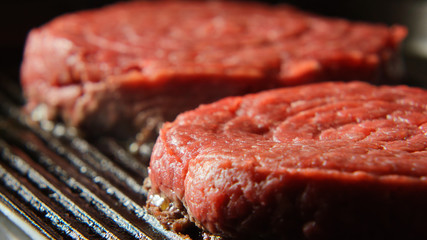 Two Fresh Beefsteaks on a grill