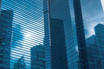 Obraz na płótnie Canvas Modern Business Office Building Windows Repeating Pattern Blue Glass Facade