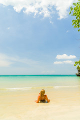 Fototapeta na wymiar Woman on the Thai beach of Railay in Krabi