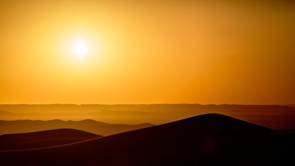 Beautiful sunset over the sand dunes in the Sahara desert, Morocco