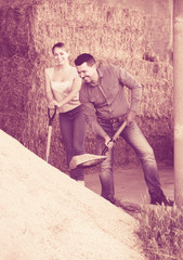 Workers standing with metallic spades