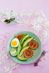 Spring, diet salad on a pink background