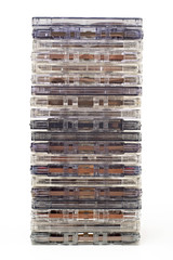 Stack of old audio cassettes isolated on white background