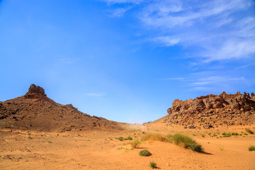 Excursion of tourists in off road vehicles in desert