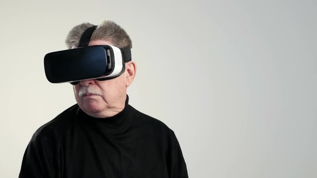  aged man in VR glasses