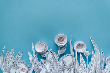 Paper art and origami concept of Flower meadow. White paper flower on blue background