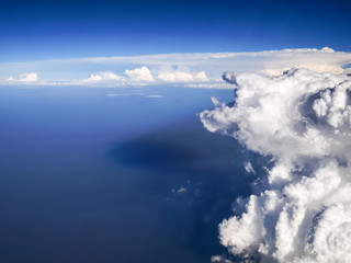 Spectacular aerial view from airplane window, beautiful, unique and picturesque white clouds with...