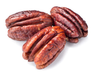 roasted pecan fruits on white, (large depth of field, taken with tilt shift lens)