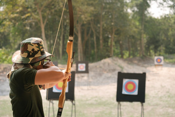 Asian Male Soldier training with the arror and bow