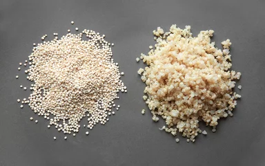 Gordijnen Two heaps of raw and boiled organic white quinoa grains, closeup © Africa Studio
