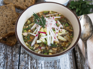 Cold summer soup with vegetables and herbs with kvass. Russian traditional soup. 
