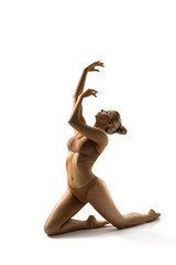 Girl with bronzed body perfoming at studio, cutout