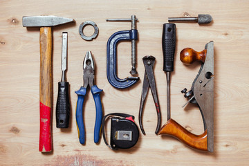 Composition of old carpenter tools on the wood table