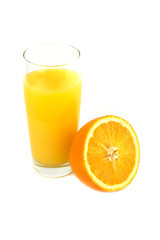Fresh ripe orange and orange juice on a wooden background