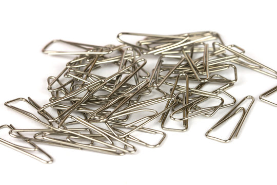 Heap of metal clips isolated on a white background