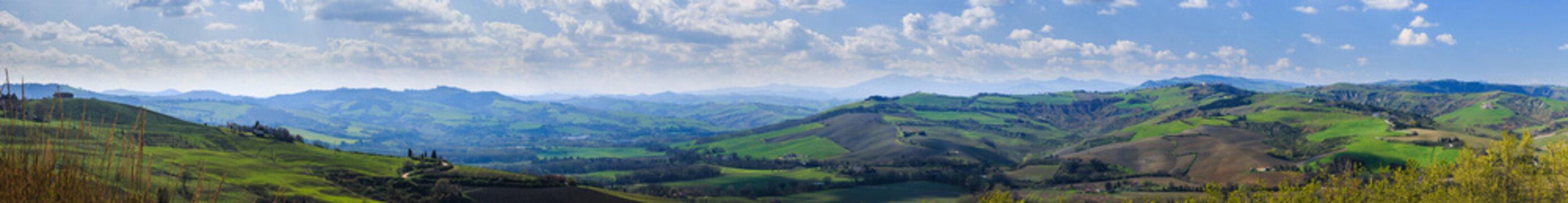 Large Panorama of the Apennine hills around the medieval village of Montefabbri. Marche, Italy