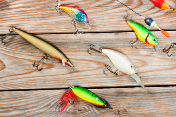 Fishing accessories on a wooden background. © Alex Ishchenko
