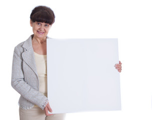 Mature woman leaning on white banner. Portrait against of white background