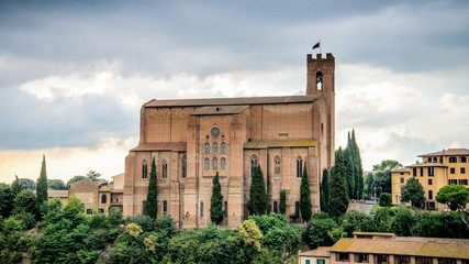 Siena, Italy - September 5, 2014: Scenery of Siena, a beautiful medieval town in Tuscany, with view of the Basilica of San Domenico