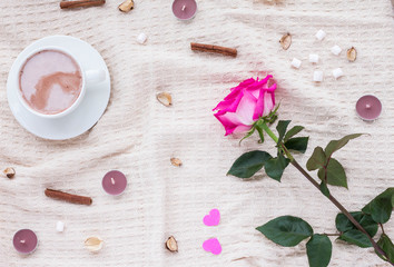 Composition with coffee, rose, cinnamon sticks, marshmallows and candles. Valentine's day. Flat lay.