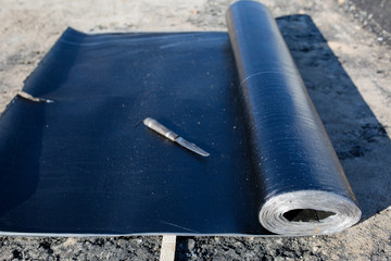 Cutting roofing material during waterproofing works