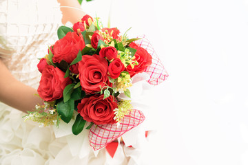 Beautiful wedding bouquet in hands of the bride