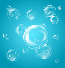 Realistic Transparent Soap Bubbles with Reflection on Blue Background