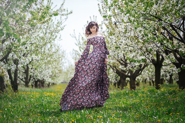 beautiful woman in dress in the gardens