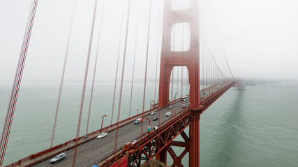 Foggy Golden Gate Bridge in San Francisco in early morning.