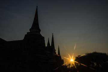 Silhouette Pagodas with sun stars
