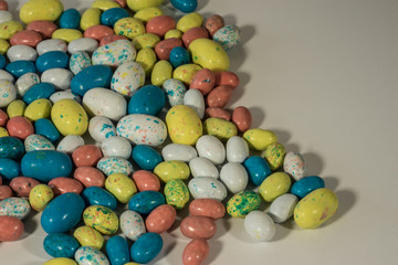 Fototapeta na wymiar Multi-colored candy Easter Eggs on a white background