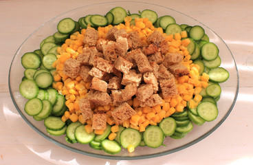 Salad with vegetables, herbs, corn, bread crustons and yogurt