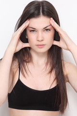 Obraz premium Young beautiful slim girl with headache expression