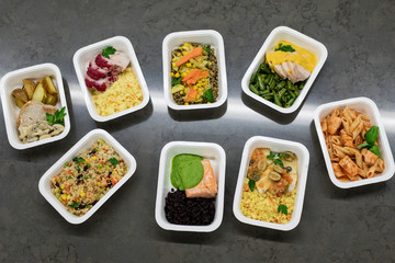 A variety of fast food in plastic boxes