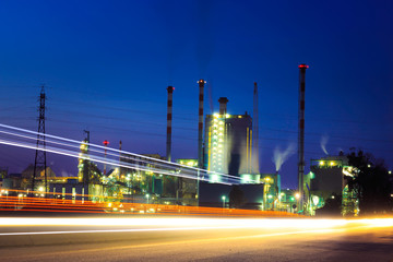 Industrial power plant with traffic light by night