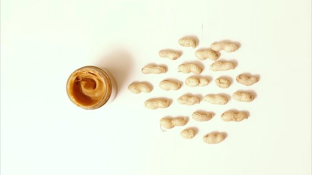 Jar of peanut butter escapes from peanuts. Stop Motion Animation