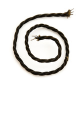 closeup of twisted vintage electro cable, spiral form, isolated on white