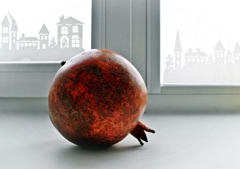The fruit of the pomegranate on the windowsill - 141038977