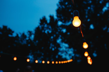 Hanging decorative lights for a wedding party