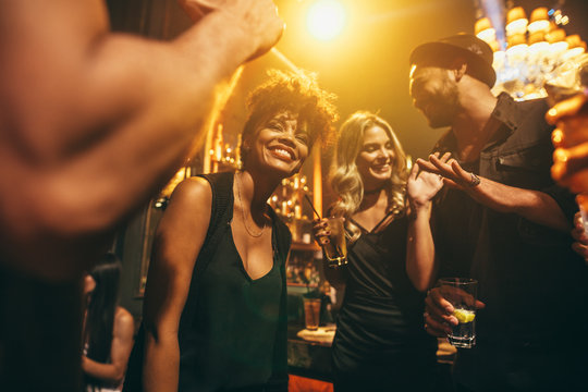 Happy young people having fun a nightclub