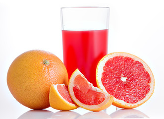 Glass of pink grapefruit juice over white background.